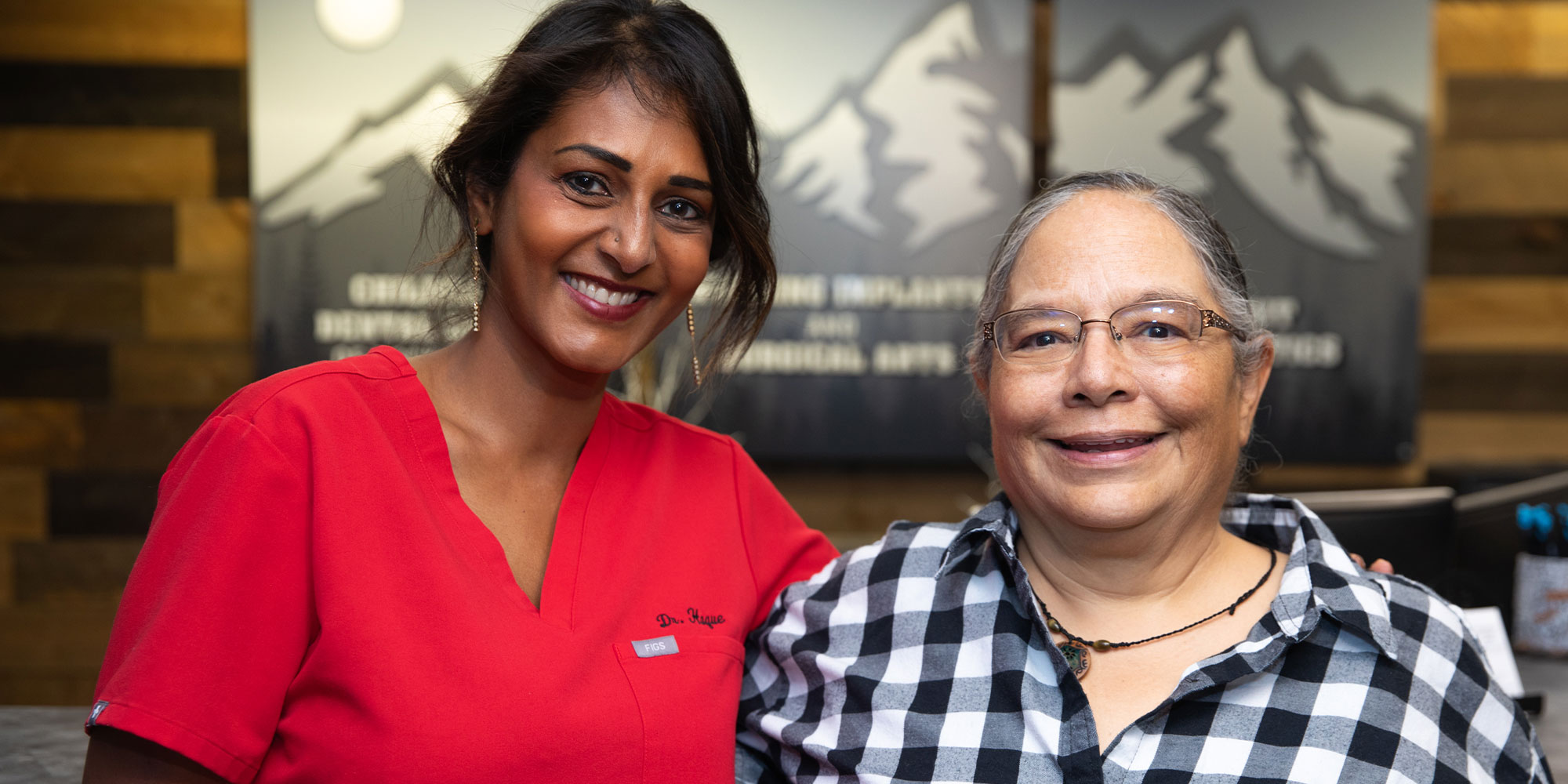 Patient and doctor smiling together