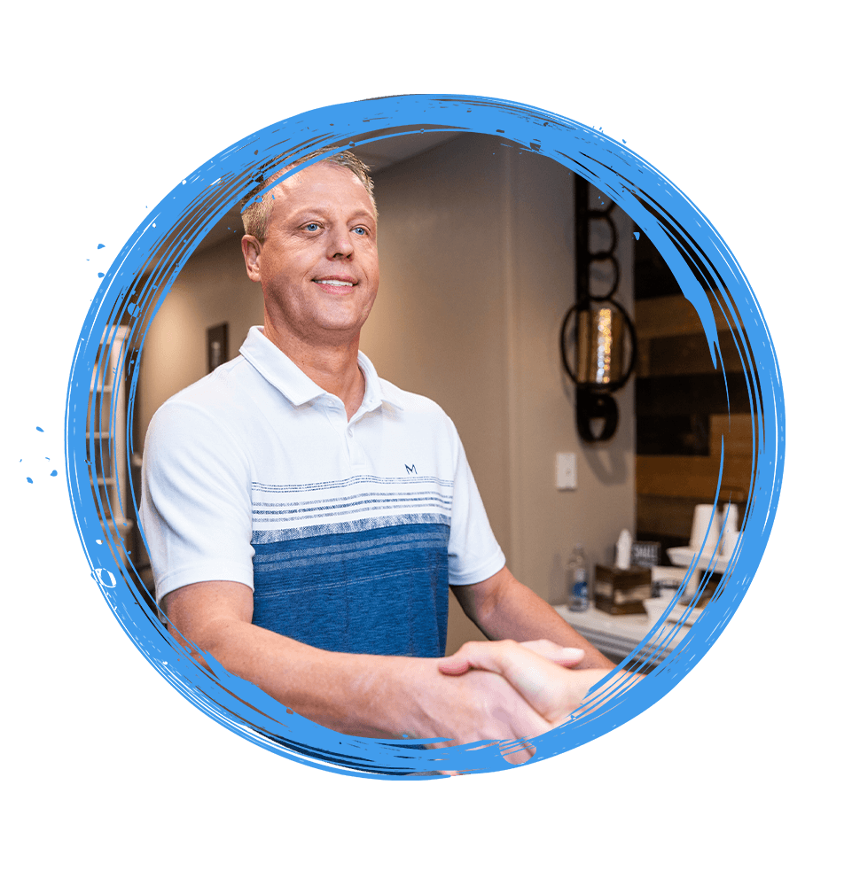 team member shaking Patients hand