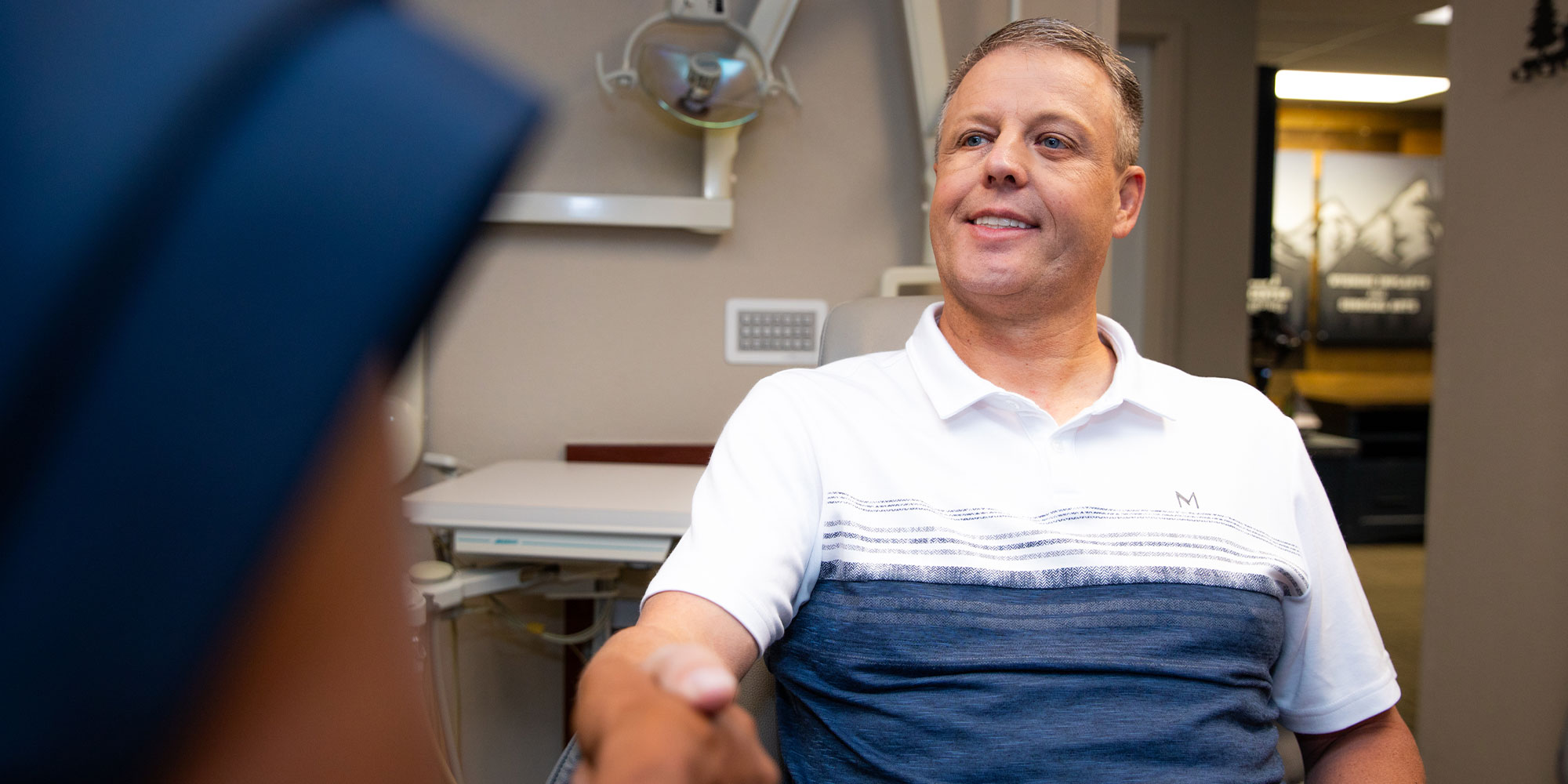 Patient shaking doctors hand
